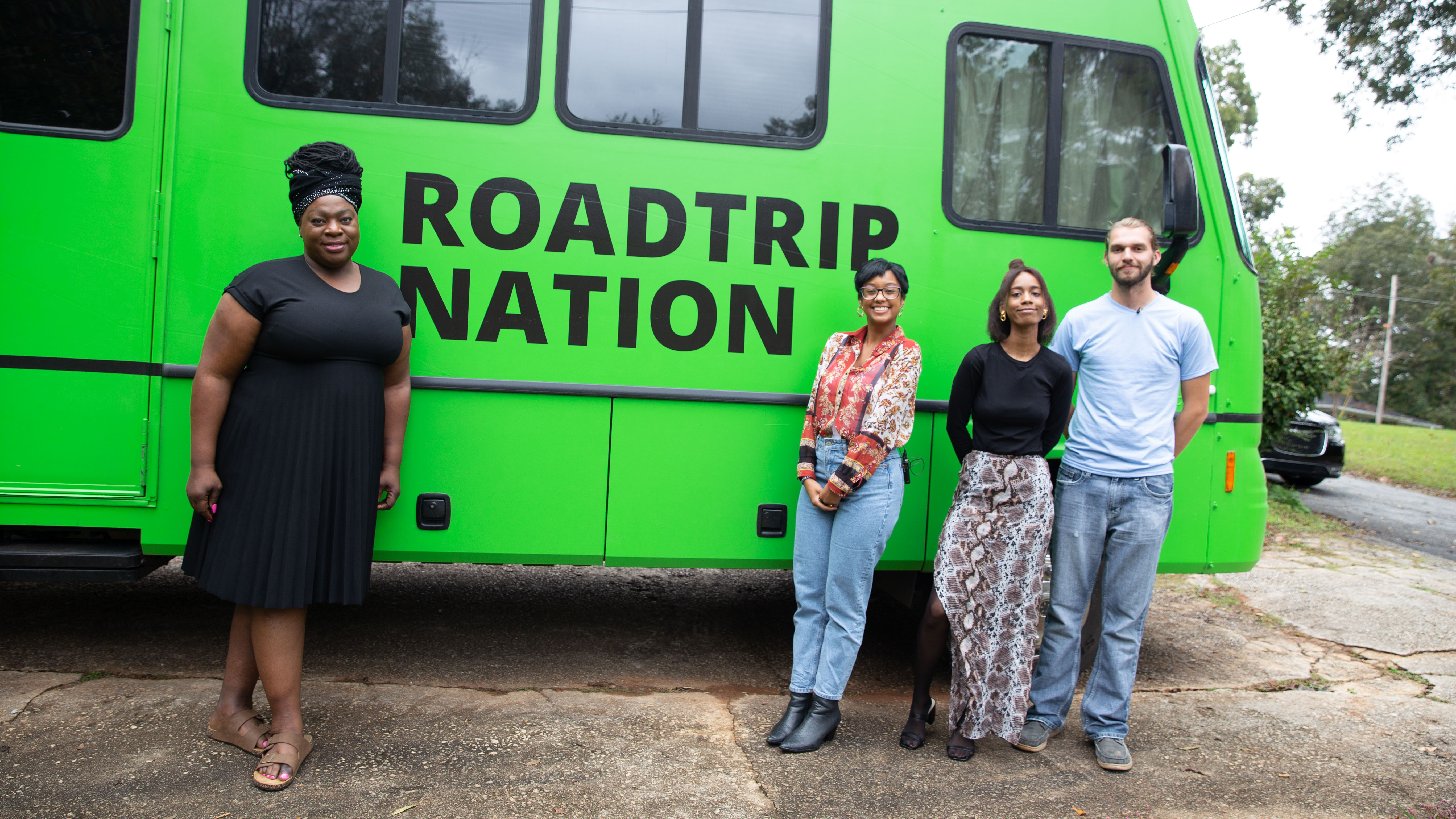 First from left, Tori Cooper, director of community engagement for the Human Rights Campaign’s Transgender Justice Initiative, takes a photo with the roadtrippers outside the green RV.